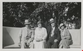 Two couples sitting on a bench, [193-?] thumbnail
