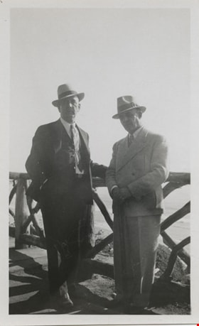 Two men leaning on hand rail, [193-?] thumbnail