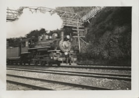 Train passing under pedestrian overpass, [between 1930 and 1949] thumbnail