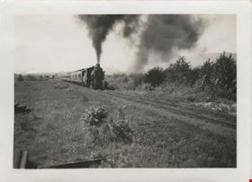 Train traveling along the track, [between 1930 and 1949] thumbnail