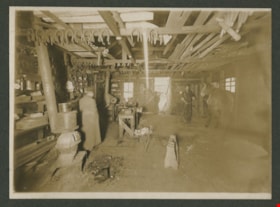 Interior of a blacksmith shop, [before 1921] thumbnail