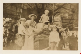 Leggett family on carousel, [between 1900 and 1919] (date of original), copied [1993] thumbnail