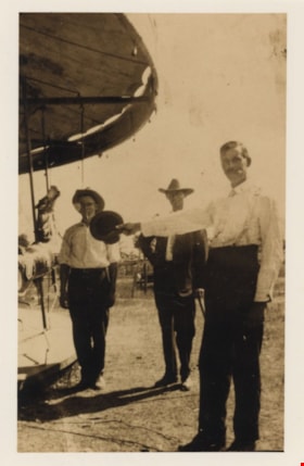 Three men beside carousel, [between 1900 and 1919] (date of original), copied [1993] thumbnail