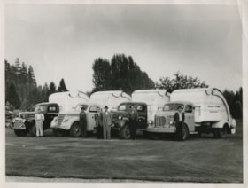 Bob O'Brien with Burnaby Garbage Department trucks, [after 1941] thumbnail