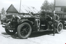 Firefighter Fred Blake beside fire truck no. 3, 1939 (date of original) thumbnail
