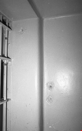 Damaged wall near cell door inside death row cell number 3, 1991 thumbnail
