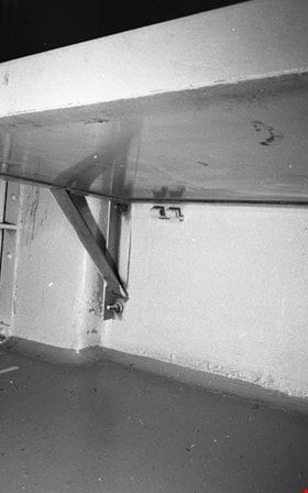 Metal bed and bracket inside death row cell number 3, 1991 thumbnail