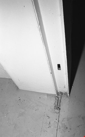 Inside view of bottom of door frame with locking slot, 1991 thumbnail