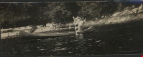 Young man paddling a canoe, Aug. 1925 thumbnail