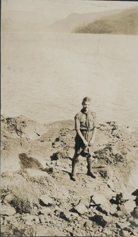 Boy Scout on rocky shore, Aug. 1926 thumbnail