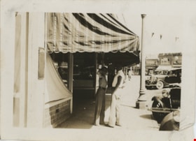 Eva and Jack standing under awning, [1936] thumbnail