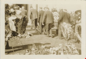 Pallbearers carrying coffin into mausoleum, 1937 thumbnail