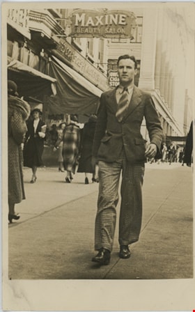 Crichton Hawkshaw walking down West Georgia Street, [1938] thumbnail