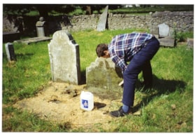 Cleaning grave of John Holmes, May 18, 1994 thumbnail