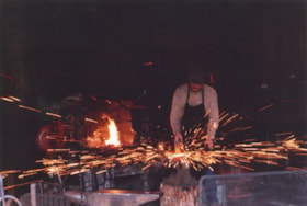Blacksmith at work, July 1, 1983 (date of original) thumbnail