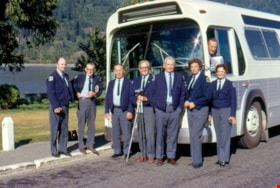 Bus drivers standing with a bus, 1973 thumbnail