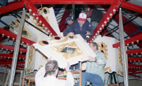 Installing the scenery of the doghouse on the carousel, [betweeen Feb. 20 and Mar. 26, 1993] thumbnail