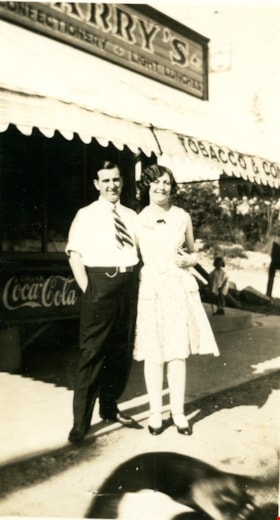 Harry Royle and woman outside Harry's confectionery store, [194-] thumbnail