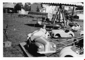 Child on amusement park ride, May 1971 thumbnail