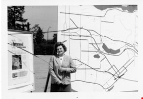 Rose Bancroft with Burnaby map and Brentwood Shopping Centre poster, 1971 thumbnail