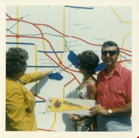 Rose Bancroft with visitors and map, 1971 thumbnail