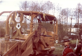 Mayor Robert Prittie operating caterpillar at Heritage Village sod-turning, 11 April 1971 thumbnail