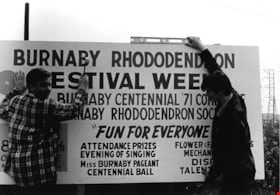 Men with Burnaby Rhododendron Festival Week sign, [May 1971] thumbnail