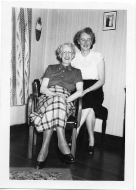 Two women sitting together, [between 1950 and 1960] thumbnail