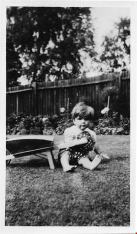 Small child sitting on the grass, [between 1940 and 1960] thumbnail