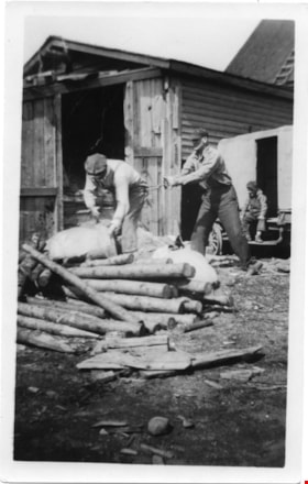 Two men working with logs, [between 1920 and 1940] thumbnail