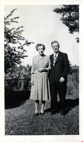 Couple standing together in yard, [between 1940 and 1950] thumbnail