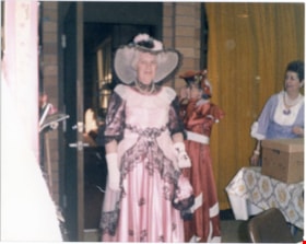 A woman in a pink costume., 1970-1980 thumbnail