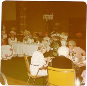 Confederation Singers in 1890's costumes sitting at a table at Lynn Valley Lodge., 1970-1980 thumbnail