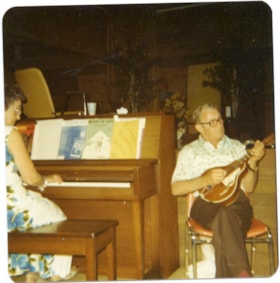 Man and woman playing instruments., 1979 thumbnail