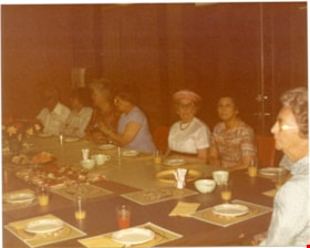 Confederation Singers seated at large table., 1982-1983 thumbnail