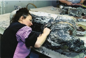 Volunteer stripping paint from carousel horse, [between 1990 and 1992] thumbnail
