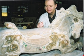 Ken Diamond stripping paint from carousel horse, [between 1990 and 1992] thumbnail