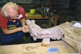 Alan Clarke working on carousel horse named Pisces, [between 1990 and 1992] thumbnail