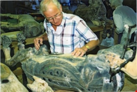 Bob Watts making repairs to carousel horse named Champion, [between 1990 and 1992] thumbnail
