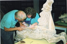 Volunteers making repairs to carousel horse named Nareena, [between 1990 and 1992] thumbnail