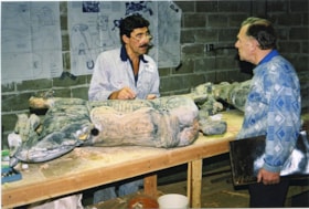 Don Wrigley and Doug Wills with carousel horses under restoration, [between 1990 and 1992] thumbnail