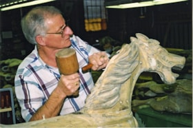 Bob Watts making repairs to horse from C.W. Parker no. 119 carousel, [between 1990 and 1992] thumbnail