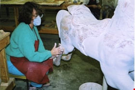 Delia Wellwood sanding C.W. Parker no. 119 carousel horse named Bingo, [between 1990 and 1992] thumbnail