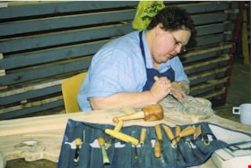Carver working on restoration of Wurlitzer band organ, [between 1990 and 1992] thumbnail