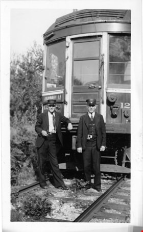 Conductor and Motorman in front of B.C. Electric Railway tram, 1940 thumbnail