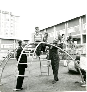 Bob Williams and Harold Winch with children at a playground, [1968?] thumbnail