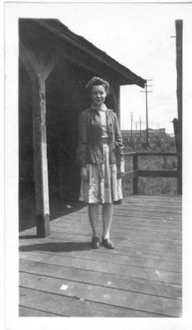 Woman at interurban station, [ca. 1930] thumbnail