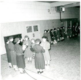 Girl Guide ceremony in gymnasium, Aug 1960 thumbnail