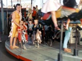 Riders on C.W. Parker Carousel at the PNE, [1960-1969] thumbnail