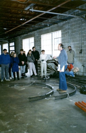 Group of volunteers with carousel parts, [between 1989 and 1999] thumbnail